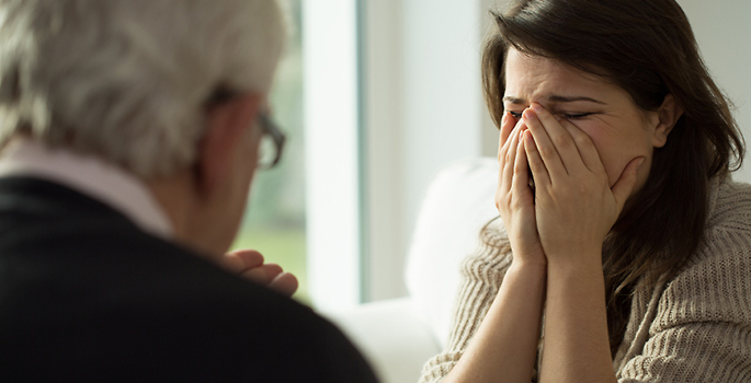 woman crying in psychotherapy