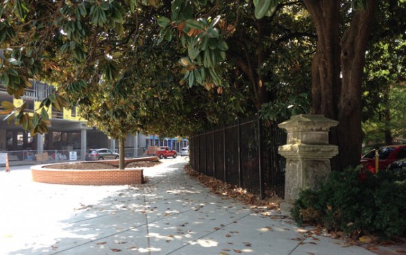 A new pedestrian plaza near the stone pillars of the university’s historic entrance features low brick walls ideal for sitting. (Vanderbilt University) 