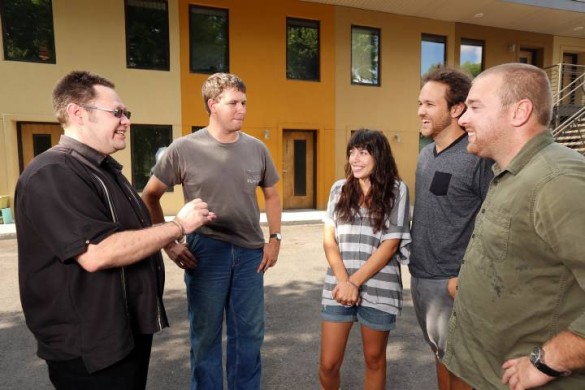 group standing in front of friendship house