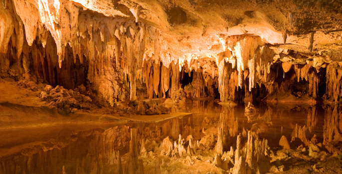 cave interior spiked with stalagmites and stalactites