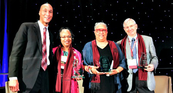 L-r: James Wadley, board member, American Association of Blacks in Higher Education, with this year's winners: Iris L. Outlaw, Exemplary Award for Public Service; Emilie M. Townes, Pacesetter Award; and John von Knorring, Advocacy Award. (courtesy of AABHE)