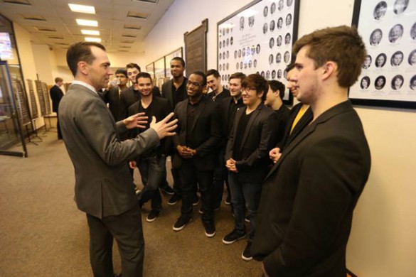 Rep. John Ray Clemmons (left), who represents the district that includes Vanderbilt, greets members of the Melodores, who entertained legislators in the hallways of Legislative Plaza. (John Russell/Vanderbilt)