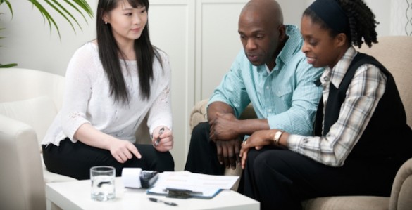 a couple having a meeting with a financial planner