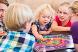 Children playing a board game. (iStockphoto)