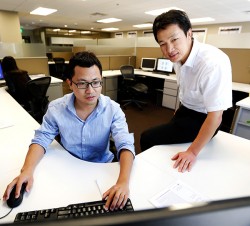Luo and Song at computer