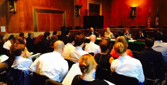 students attending panel in conference room