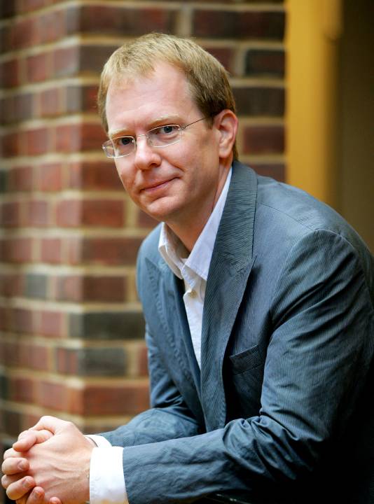 Ted Fischer leaning on railing