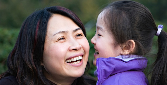 Asian woman and daughter laughing