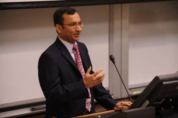 Ramanujam speaking at a podium