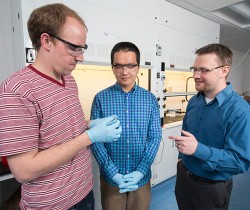 Researchers talking in lab