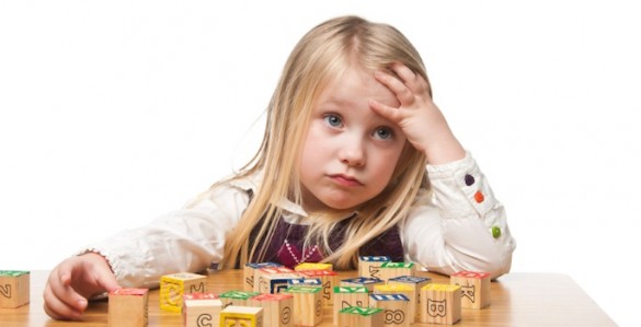 bored child with blocks