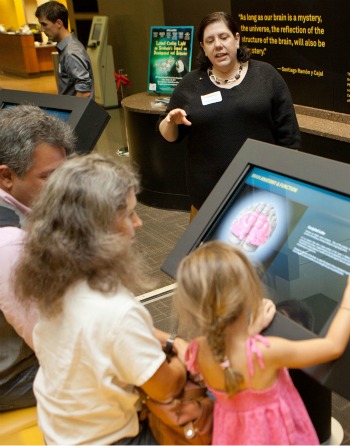 Family looking at electronic display