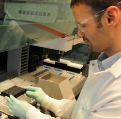 Scientist holding test tubes