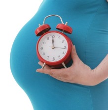 Pregnant tummy and clock