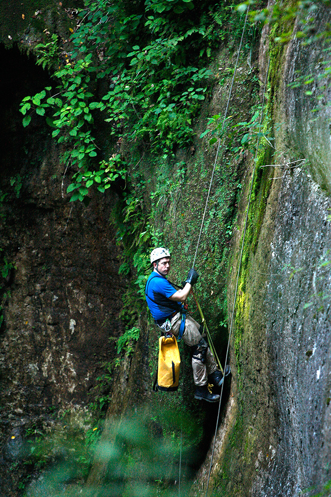 Caving expert John Hickman, who accompanies Bachmann on his underground expeditions, repels down to the entrance of the Snail Shell Cave near Murfreesboro, Tenn
