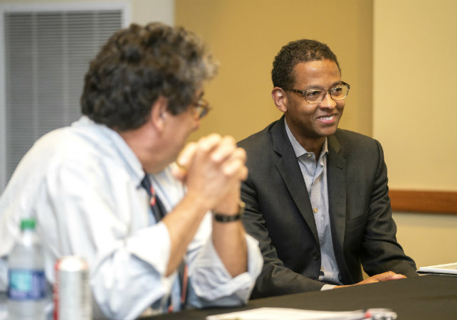 Left to right: Chancellor Nicholas S. Zeppos and NFL executive and Law School alumnus Adolpho A. Birch III meet with students at the Black Cultural Center