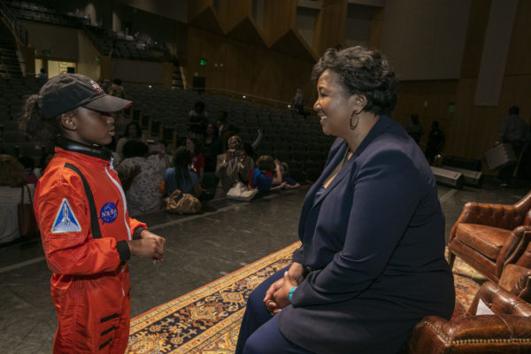  Mae Jemison speaks with a local second-grader who dressed up as the former astronaut for a school report earlier in the day. (Anne Rayner/Vanderbilt)