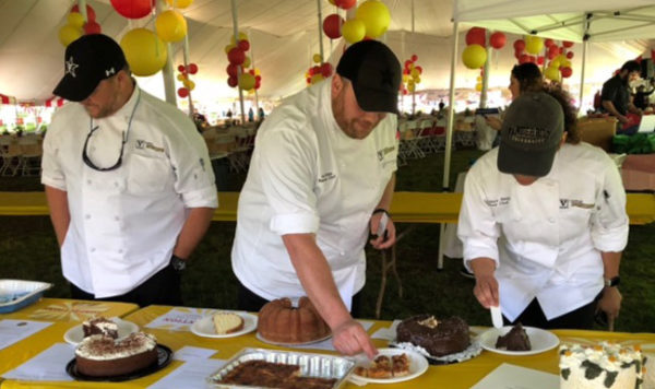 Judges sample entries for the Employee Appreciation Picnic baking contest on May 14. (Vanderbilt University)