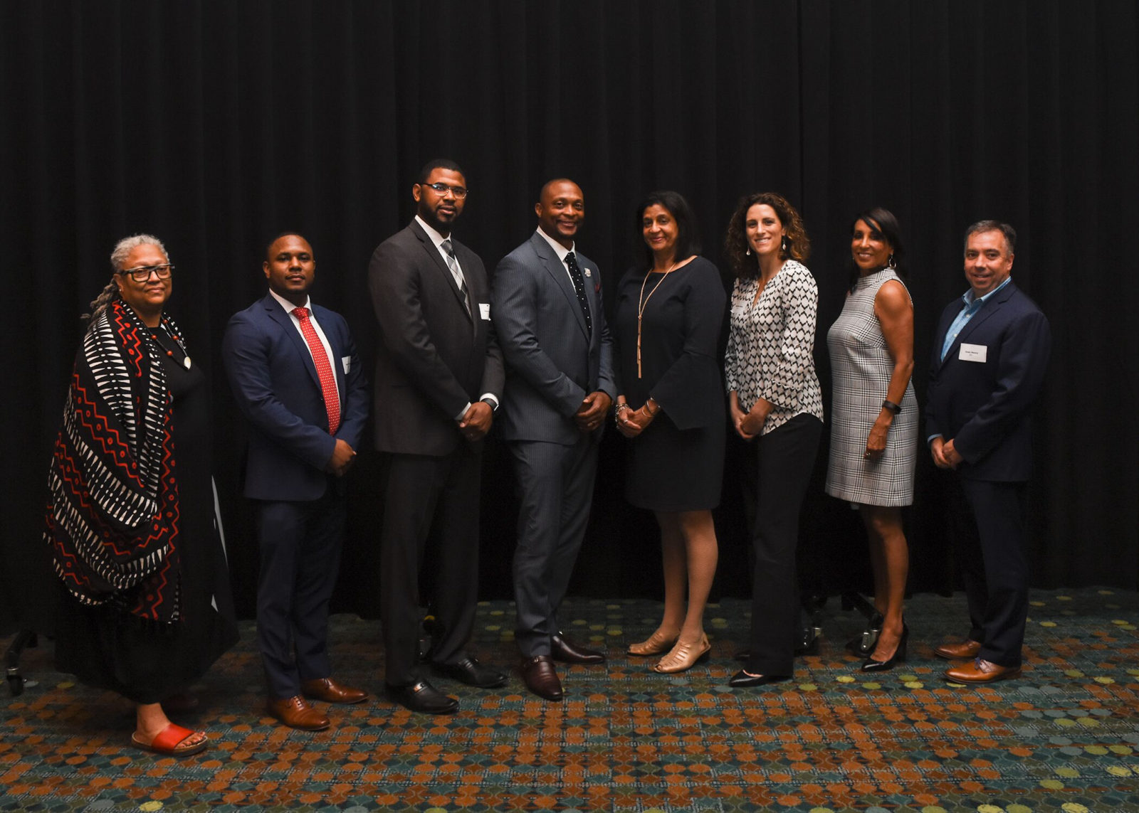 Honoree Gail Williams (fifth from left) poses with panelists (from left) Rev. Dr. Emilie M Townes, Robert Sherrill, Shan Foster, Eddie George, Stephanie White, emcee Vicki Yates and Sean Henry.(Photo by Morgan Yingling)