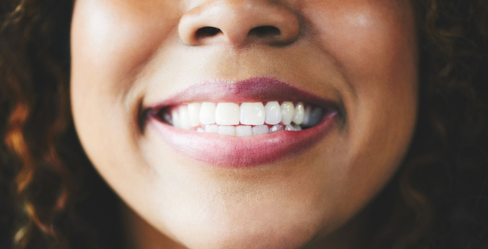 Close up of smiling African-American woman's mouth