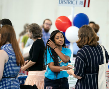 Candidates and campaign staffers greeted those attending a meet-the-candidates picnic in advance of the Aug. 1 Nashville election (photo by Joe Howell/Vanderbilt University)