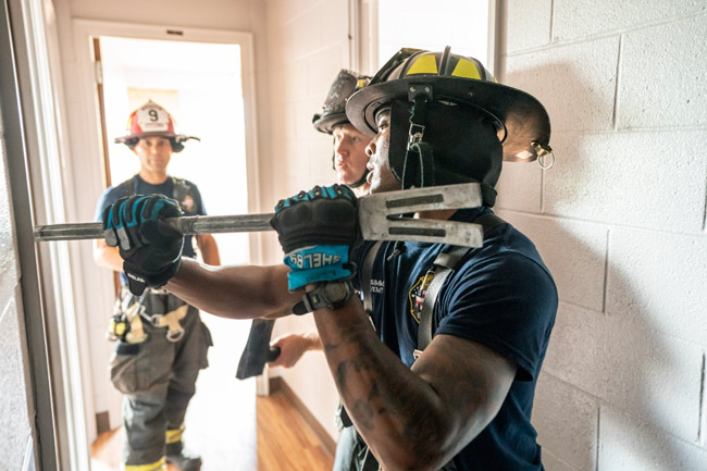 Nashville firefighters deployed hoses, operated ladders, forced open doors and practiced search-and-rescue tactics when they took part in a unique training opportunity at Vanderbilt University’s 14-story Carmichael Tower 4 residence hall June 18-29. (John Russell/Vanderbilt)