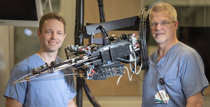 Webster and Herrell standing with telescoping surgical device