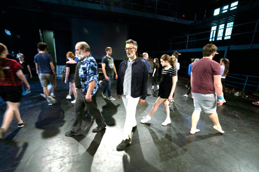 Mark Cabus (center) with other cast members of 'The Tempest' rehearsing at Neely Auditorium (Joe Howell)