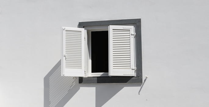 white building with open window shutters on the Island of Panarea, Sicily