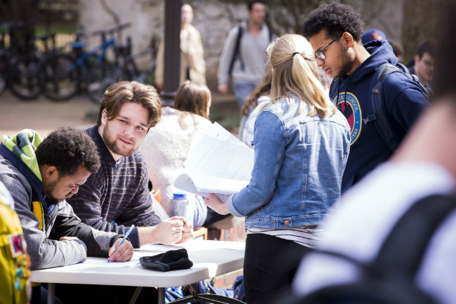 Student organizations, which are organized within the Student Engagement and Leadership cluster, often engage new students during sign-off opportunities on Rand Wall (Vanderbilt University) 