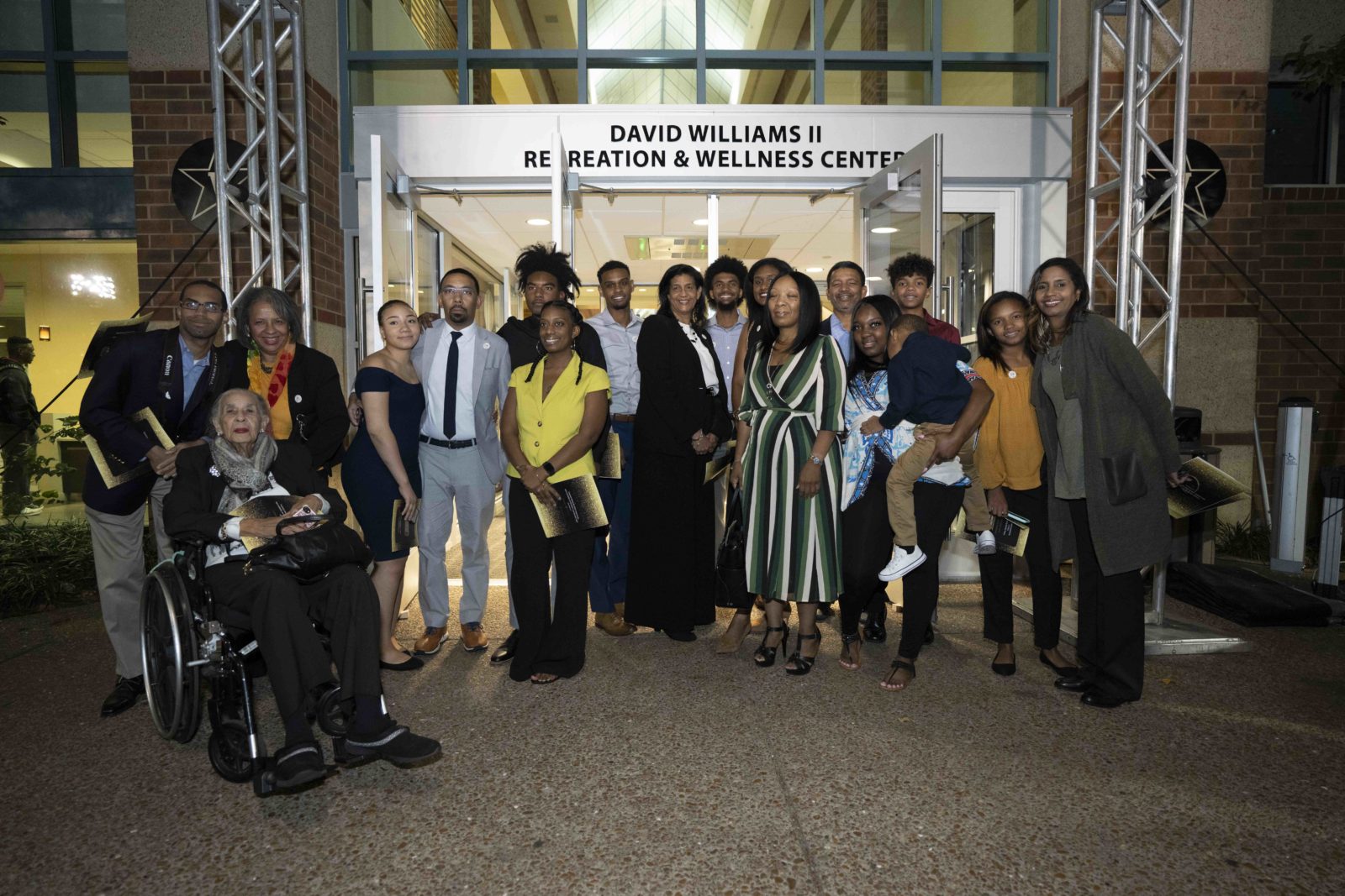 Friends and family of David Williams stand in front of the new signage at the David Williams II Recreation and Wellness Center. (John Russell/Vanderbilt University)