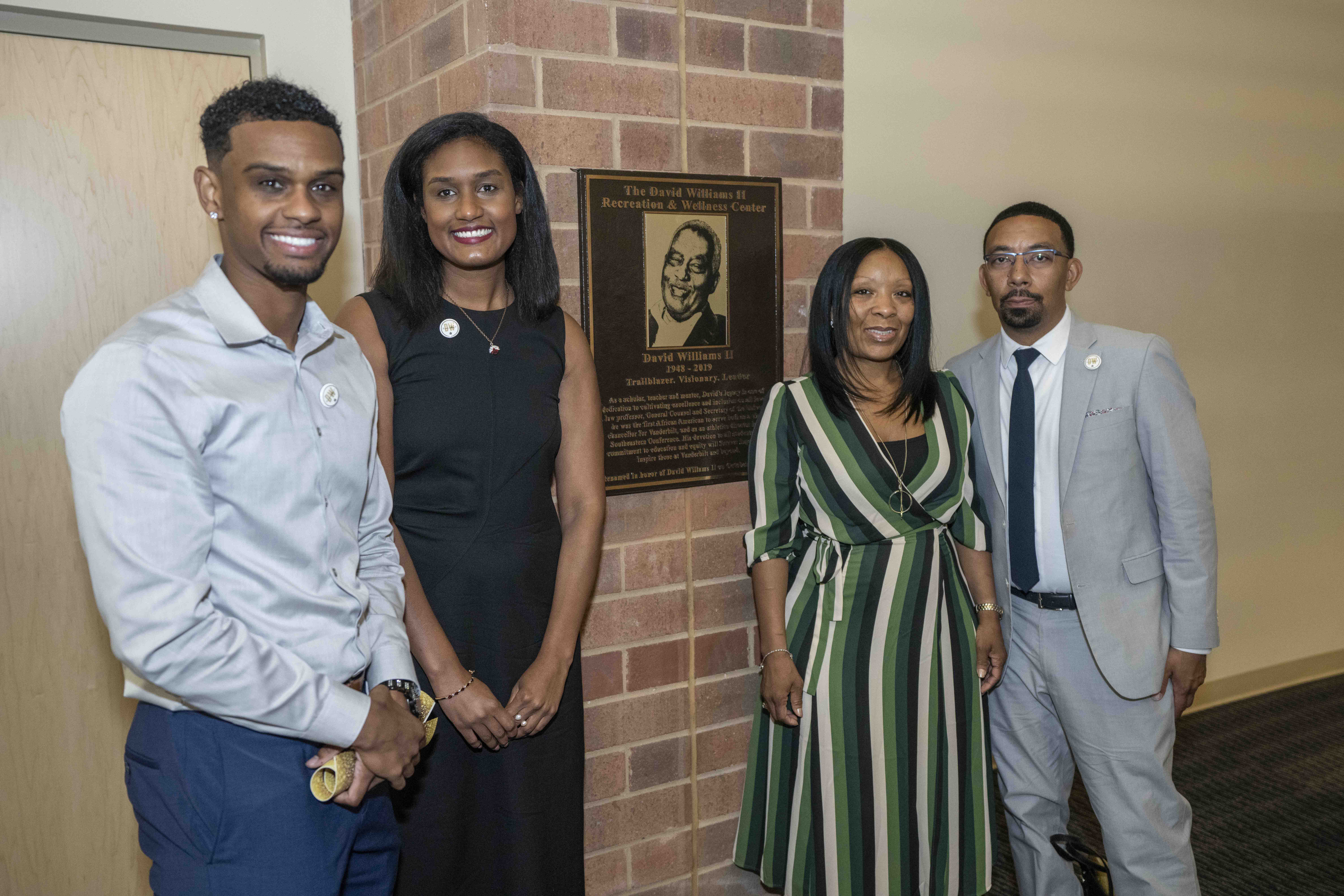 David Williams' children stand next to a new plaque honoring Vanderbilt's late former athletics director and vice chancellor. (John Russell/Vanderbilt University)