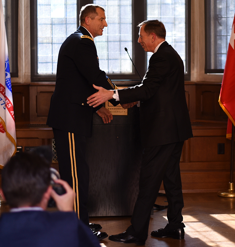 Former CIA Director and retired Army Gen. David Petraeus (right) congratulates Vanderbilt alumnus Maj. Gen. William “Bill” Hickman, BS’83, MBA’92, on his upcoming retirement from the U.S. Army. (Adrienne Burns/Vanderbilt)