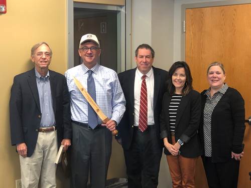 Vice Chancellor Lutz poses with a Roman glades sword replica