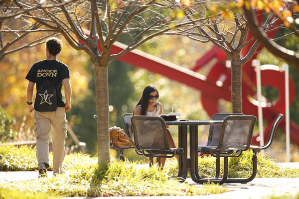 Students hang out on the plaza near Ingram Studio Arts building amid fall colors.(John Russell/Vanderbilt University)