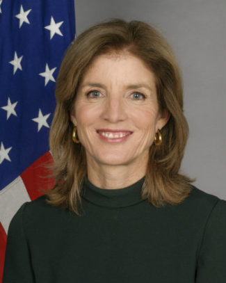 Caroline Kennedy in front of American flag 
