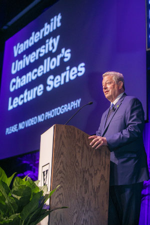 Former Vice President Al Gore at podium during climate crisis presentation at Langford Auditorium (photo by Anne Rayner at Vanderbilt University)