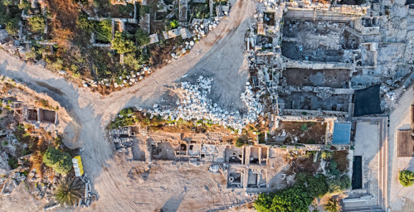 aerial view of excavated square dwellings including walls and debris of floors
