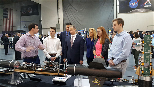 VADL team members talk with James Bridenstine, NASA Marshall Director Jody Singer and Mike Kincaid, associate administrator, Office of NASA STEM Engagement, at NASA’s Artemis Day in New Orleans. Front, left to right, Jon Powles, Alex Barnett, Bridenstine, Abbey Carlson, Sophia Moak and Adam Smith. Rear, Kincaid and Singer.