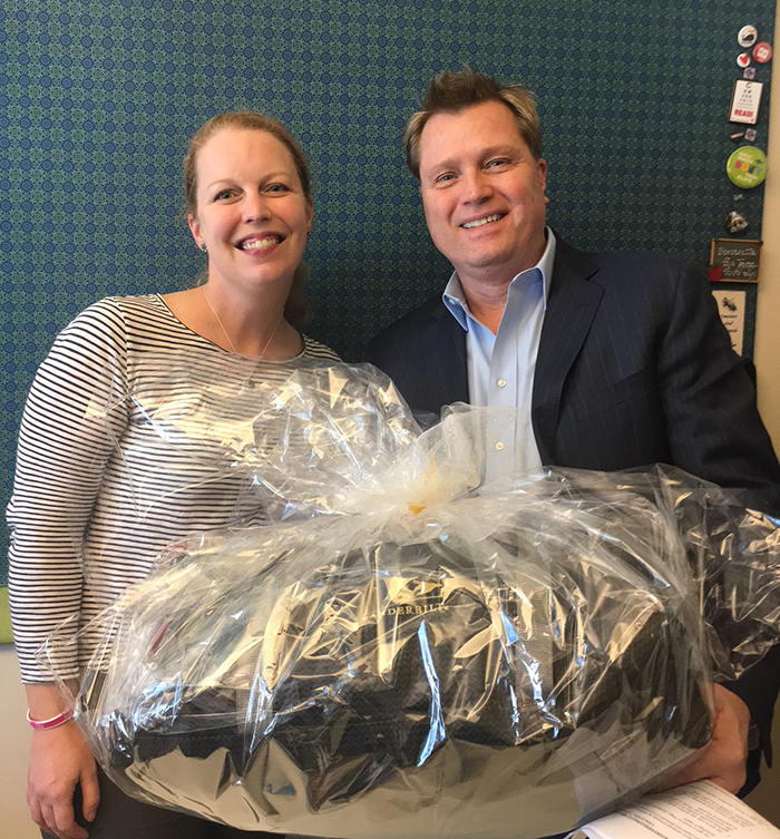 Turkey Toss game winner Emily Pendergrass (left) and Human Resources' Scott Glasgow (Vanderbilt University)