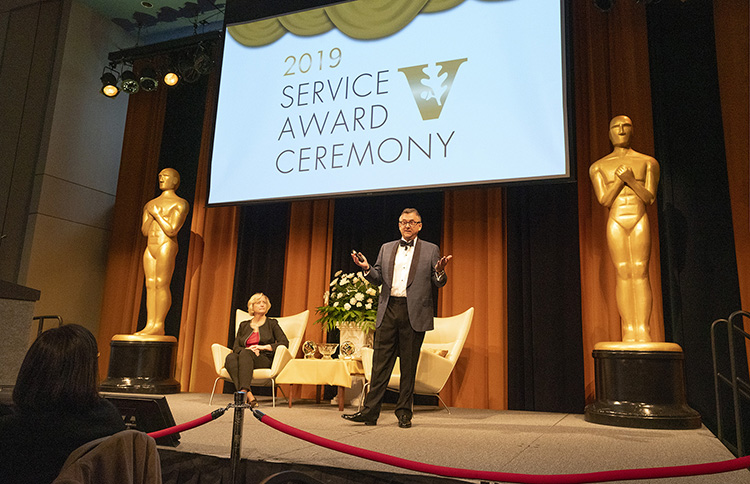 Interim Chancellor and Provost Susan R. Wente (seated) presided over the 2019 Service Award Ceremony, and Vice Chancellor for Information Technology John Lutz served as master of ceremony, Jan. 28 at the Student Life Center. (Joe Howell/Vanderbilt)