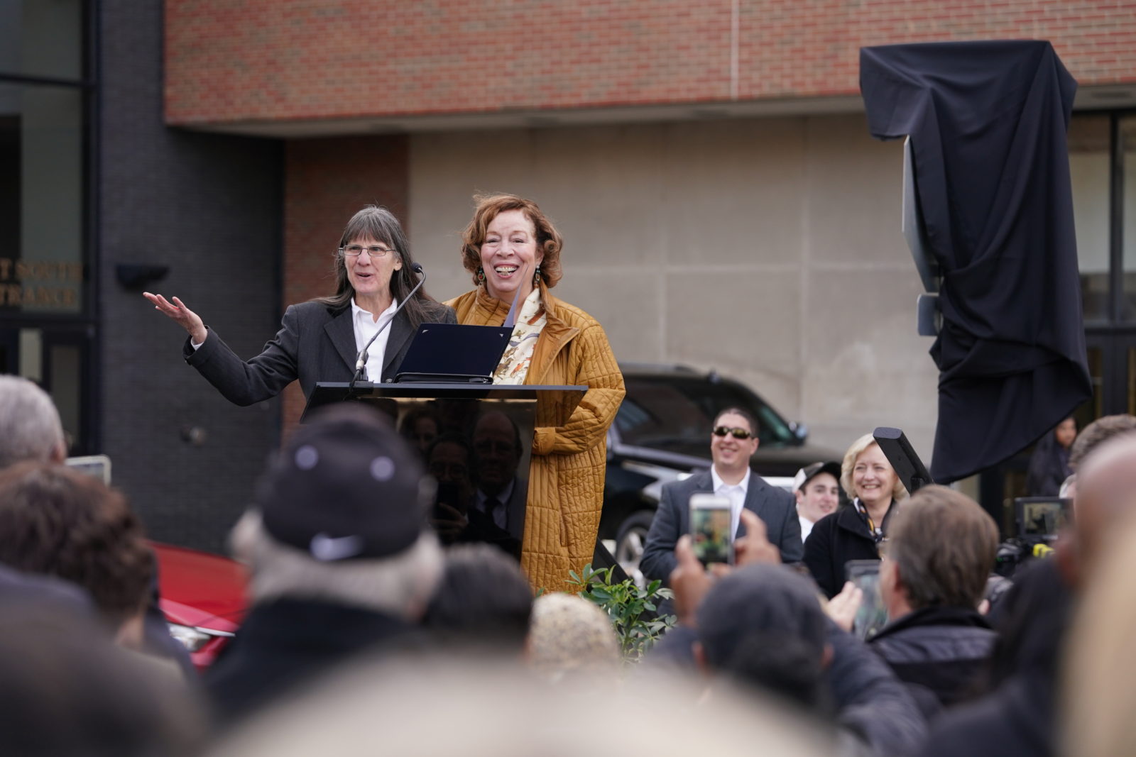 Metro Councilmember Burkley Allen presenting a resolution to Karen Wallace. (John Russell/Vanderbilt)