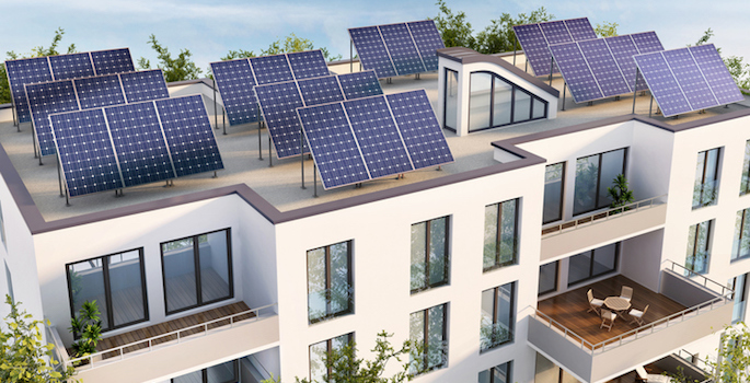Modern apartment building with solar panels on the roof