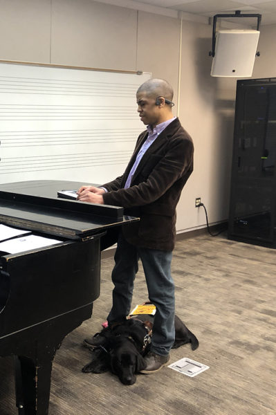 Music student using a braille reader.