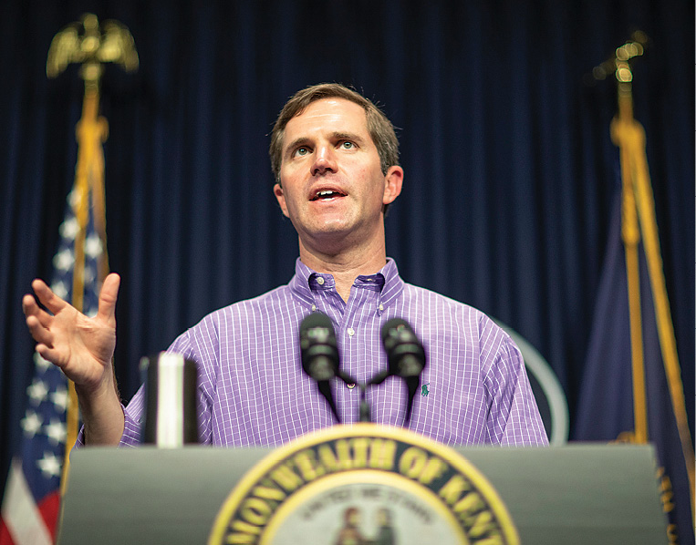 photo of Gov. Andy Beshear speaking at a podium