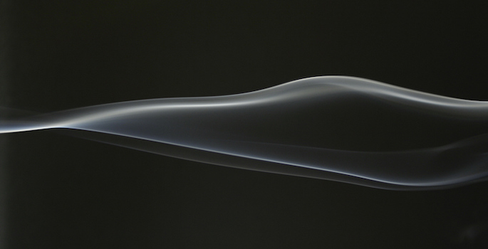 abstract concept of black smoke wave against black background