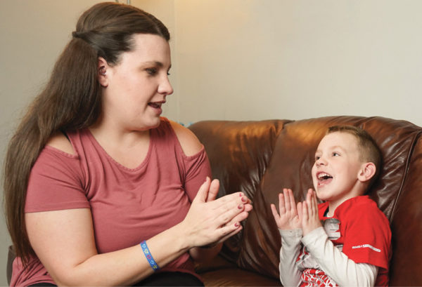 photo of Amy Ladd singing with her son Wesley