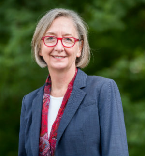 Valerie Hotchkiss with trees in background 