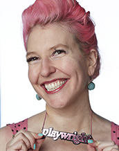 photograph of Krista Knight wearing necklace that says playwright