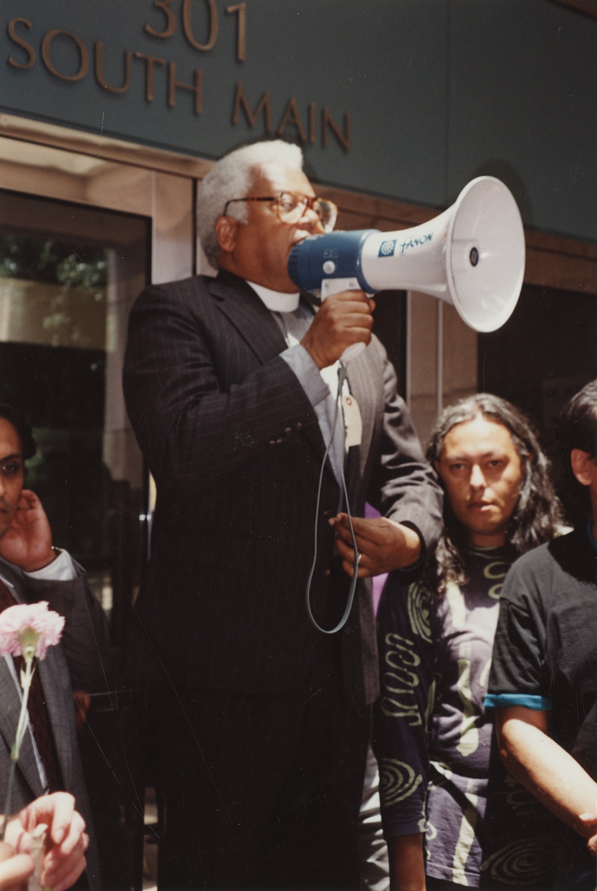 the Rev. James M. Lawson Jr. speaking to a crowd with a megaphone